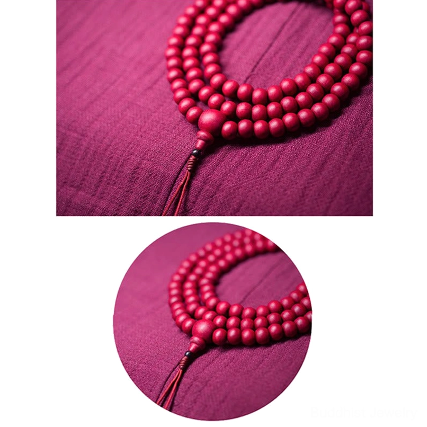 Complete 108 Abelia Biflora wooden mala bead set with knotted tassel and uniform round beads in top-down flat lay