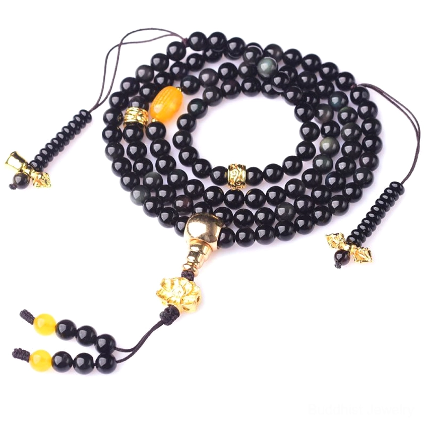 Complete 108-bead black obsidian mala set with gold-tone accessories and amber accent beads shown overhead flat lay