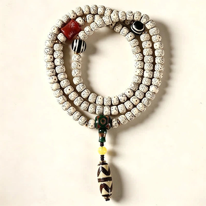 108 bead Buddhist mala bracelet with evenly spaced dotted Bodhi seeds and black metal spacer on white background