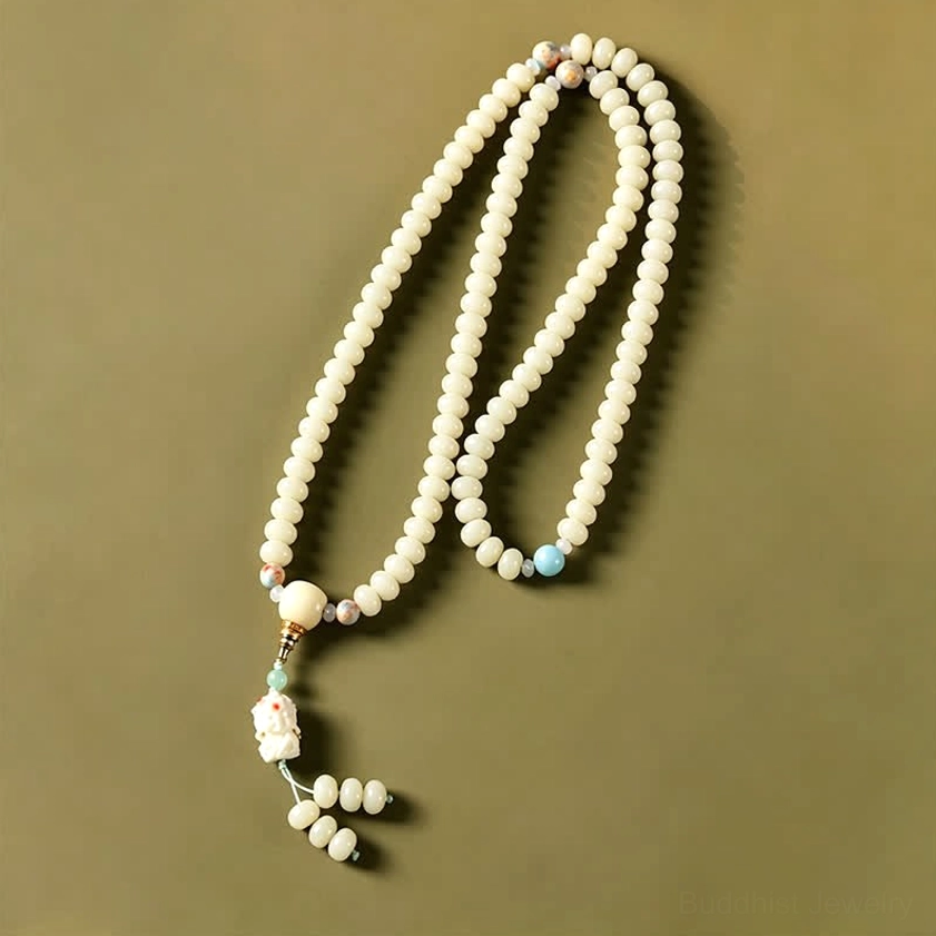 Full length 108 bodhi seed mala necklace with blue accent bead and carved Tara pendant displayed side view