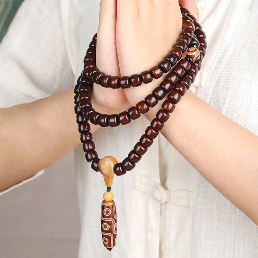 108 bead mala prayer bracelet with authentic dzi stones and jade showing protective amulet design for Buddhist spiritual practice and mindfulness