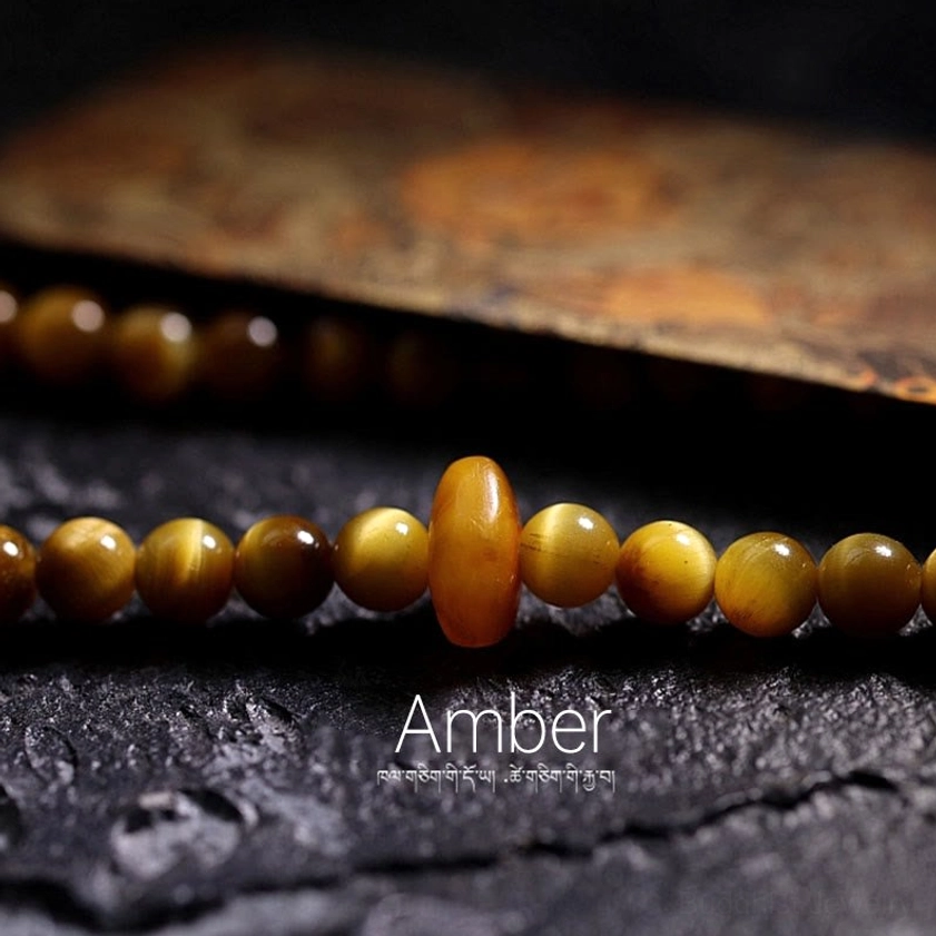 108 Buddhist prayer mala beads featuring Tiger Eye gemstone with protective energy and spiritual symbolism