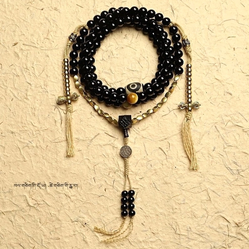 108 sacred mala beads bracelet three-eyed dzi protective amulet display