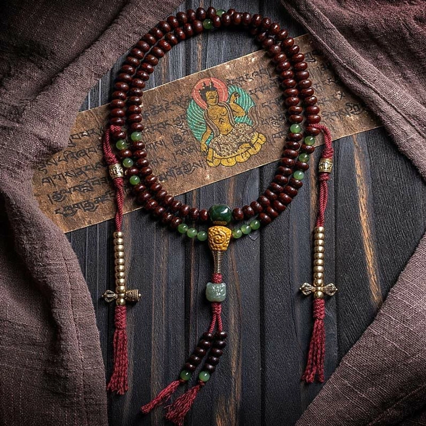 Complete Buddhist mala necklace set with 108 beads and central buddha pendant shown in circular arrangement