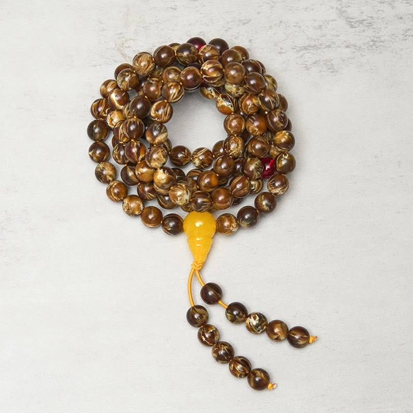 Coiled 108 meditation mala prayer beads with marbled brown amber beads and yellow guru charm - meditation practice