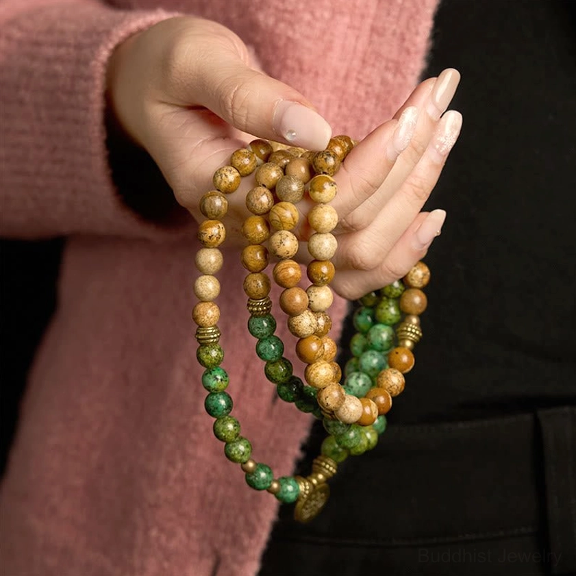 Side profile close-up of prayer mala bracelet displaying dual-tone natural stone beads and grain detail