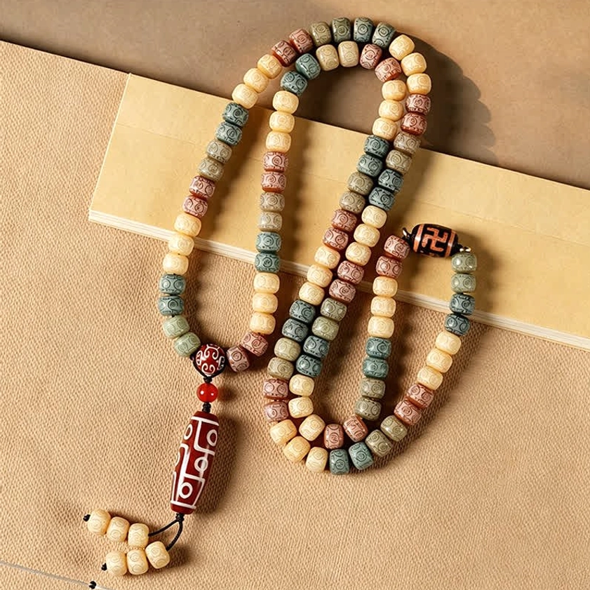 108 mala prayer beads double wrapped with dzi bead charm - light background