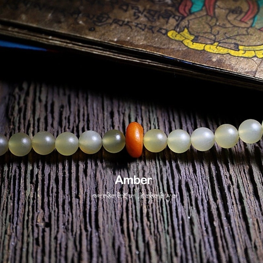 108 bead mala showing auspicious sheep horn symbolism and spiritual significance