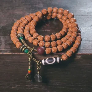 108 Rudraksha Bodhi Mala Bracelet with Nine-Eye Dzi Bead Amulet - Full Flat Lay Display