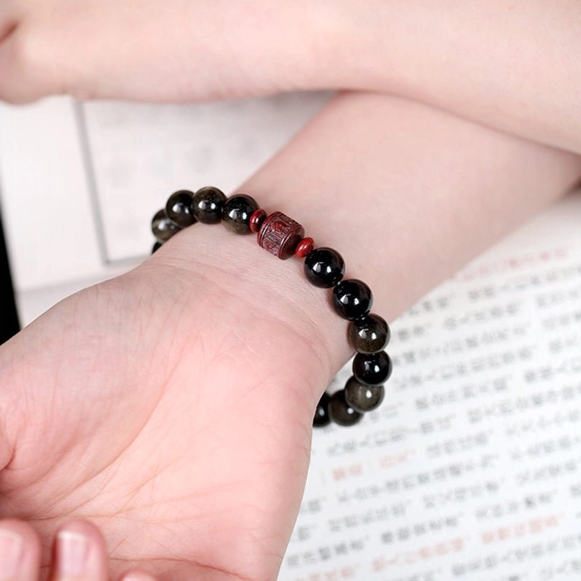 Gold Sheen Obsidian 10mm bead bracelet with cinnabar accent showing rich black color and golden iridescent shimmer