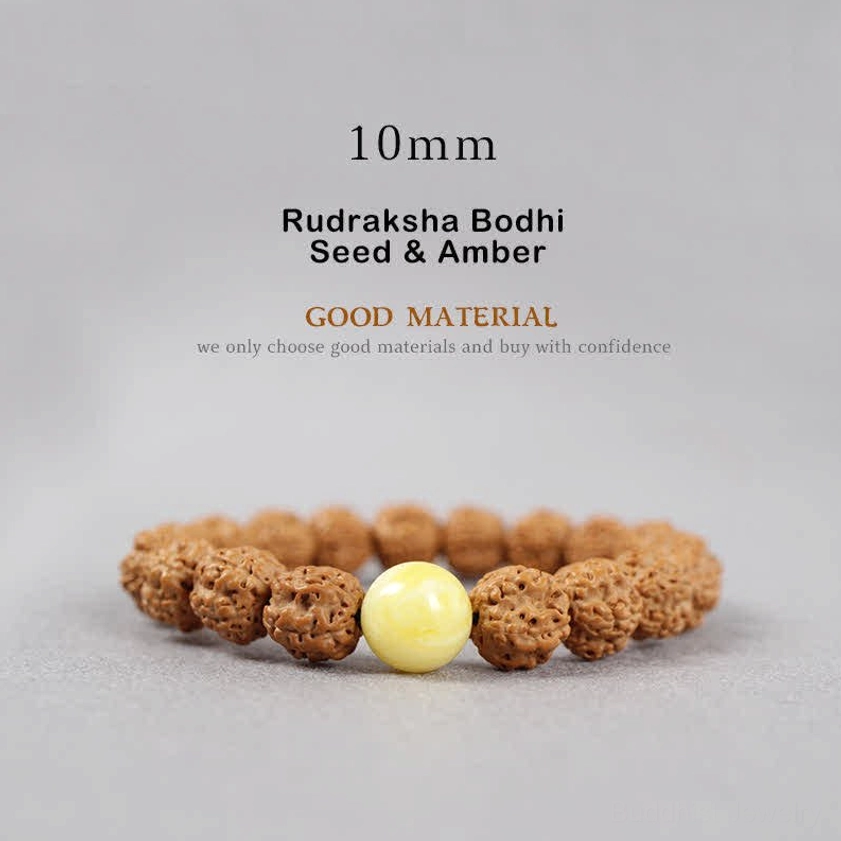 10mm Rudraksha Bodhi Seed and Amber bracelet flat lay showing medium sized brown seeds with golden yellow amber accent for warmth and healing