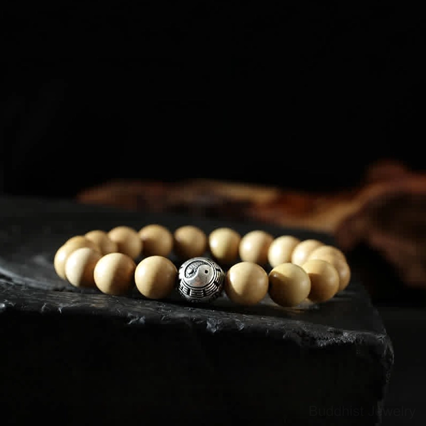 10mm yin yang Buddhist bracelet beads with balance and harmony symbols in natural peach wood