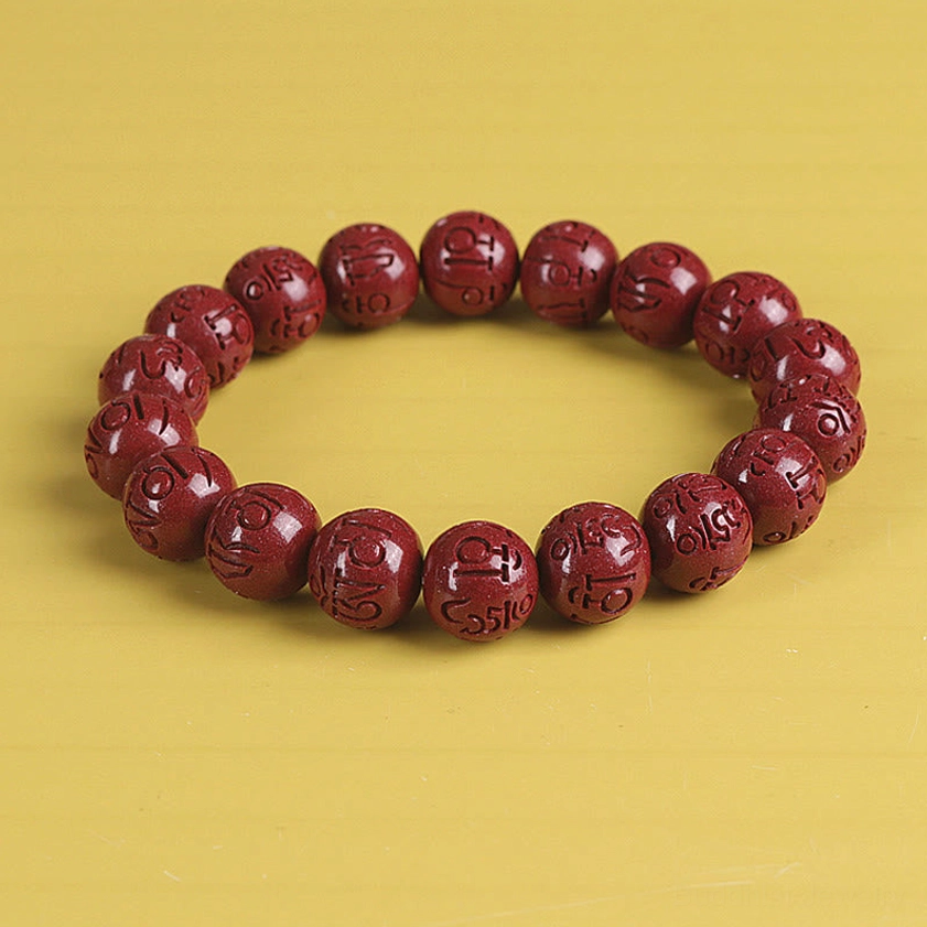 12mm cinnabar Pixiu bracelet displaying deep red natural stone and carved charms