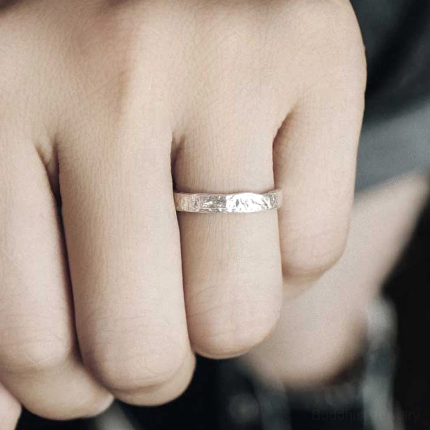 Single slim 3mm sterling silver hammered ring worn on finger, minimalist daily wear design