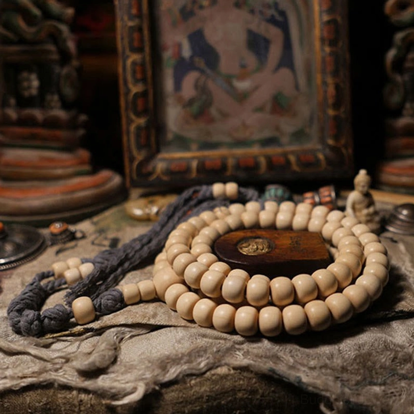 Handcrafted 108 bead Abelia Biflora wooden mala bracelet detail of six-line natural grain