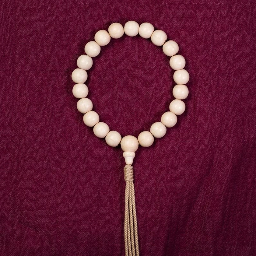 Natural Abelia Biflora wood mala bracelet featuring 10mm and 12mm bead size options for Buddhist prayer practice