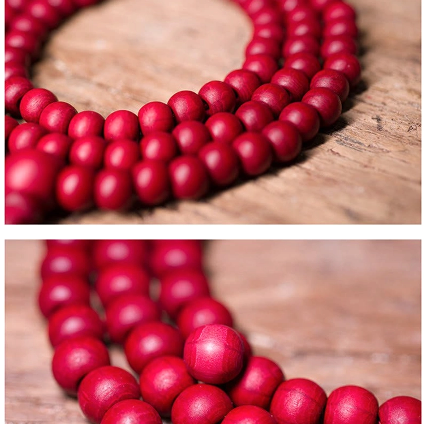 Abelia Biflora wooden prayer bead with matte red surface and subtle natural wood streaks visible