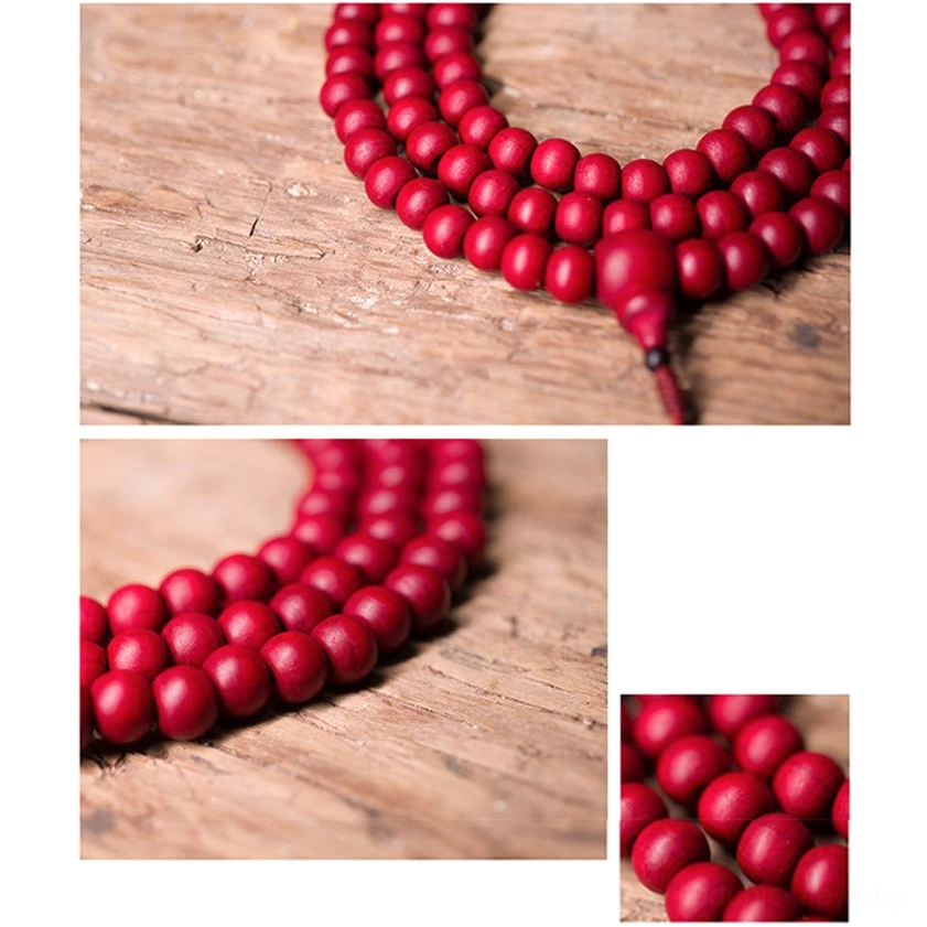 Abelia Biflora wooden bead showing deep red finish and smooth naturally curved surface from side angle