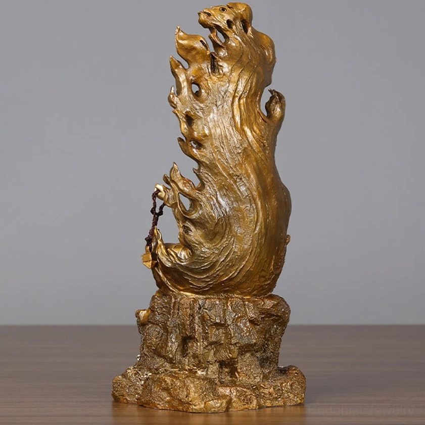Front facing Acalanatha Buddha meditation statue with golden highlights and intricate carved decorative elements