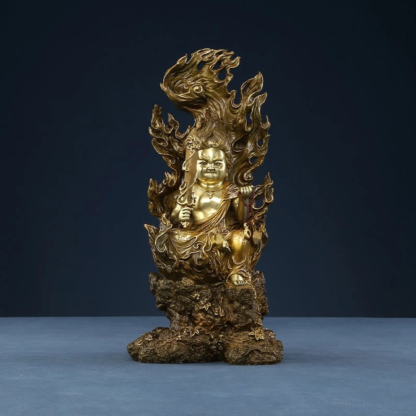 Acalanatha Buddha statue profile showing carved flame patterns and protective fierce compassion iconography
