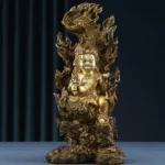 Acalanatha Buddha copper statue front view with golden finish, flame aureola, and rocky pedestal - fierce compassion meditation statue