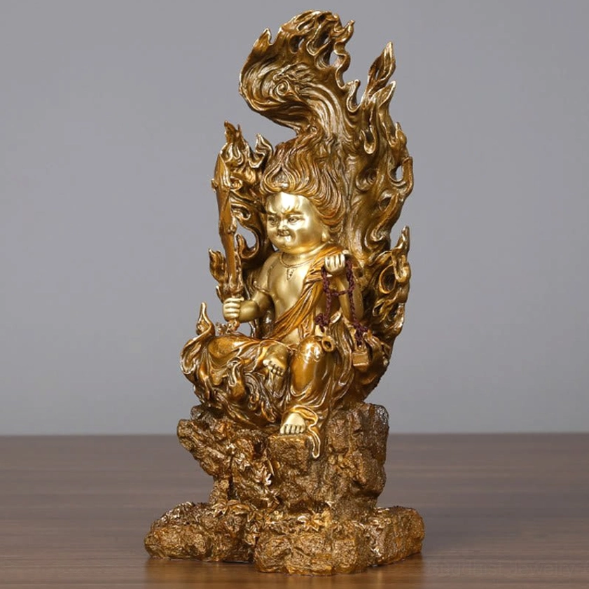 Three-quarter front view of Acalanatha Buddha copper statue with ritual sword and sacred prayer cord details