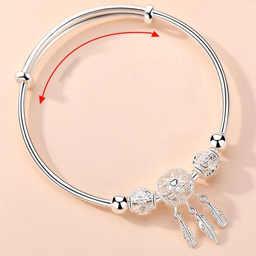 Adjustable open bangle dream catcher buddhist blessing bracelet demonstrating size flexibility and comfortable push-buckle clasp mechanism