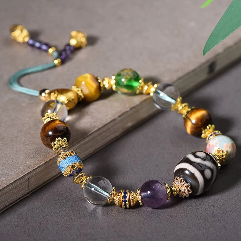 Adjustable blue braided cord Buddhist bracelet with Dzi beads amethyst tiger eye and decorative tassel