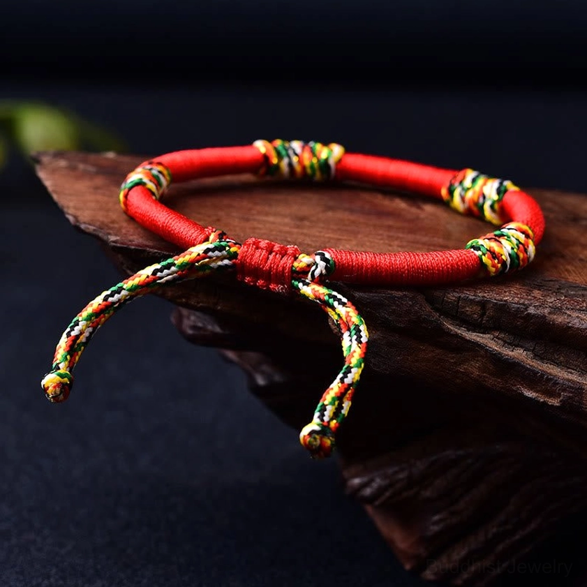 Handmade Buddhist King Kong knot bracelet showing adjustable rope design with vibrant color accents