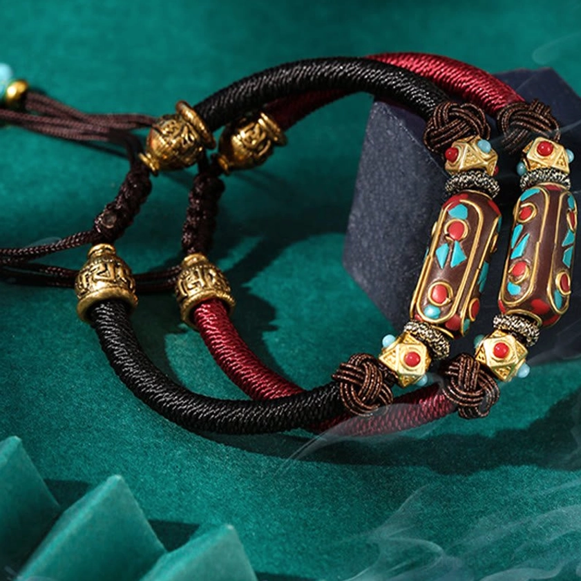 Adjustable handmade Buddhist Om Mani Padme Hum bracelet showcasing natural turquoise stone and artisanal braided cord craftsmanship