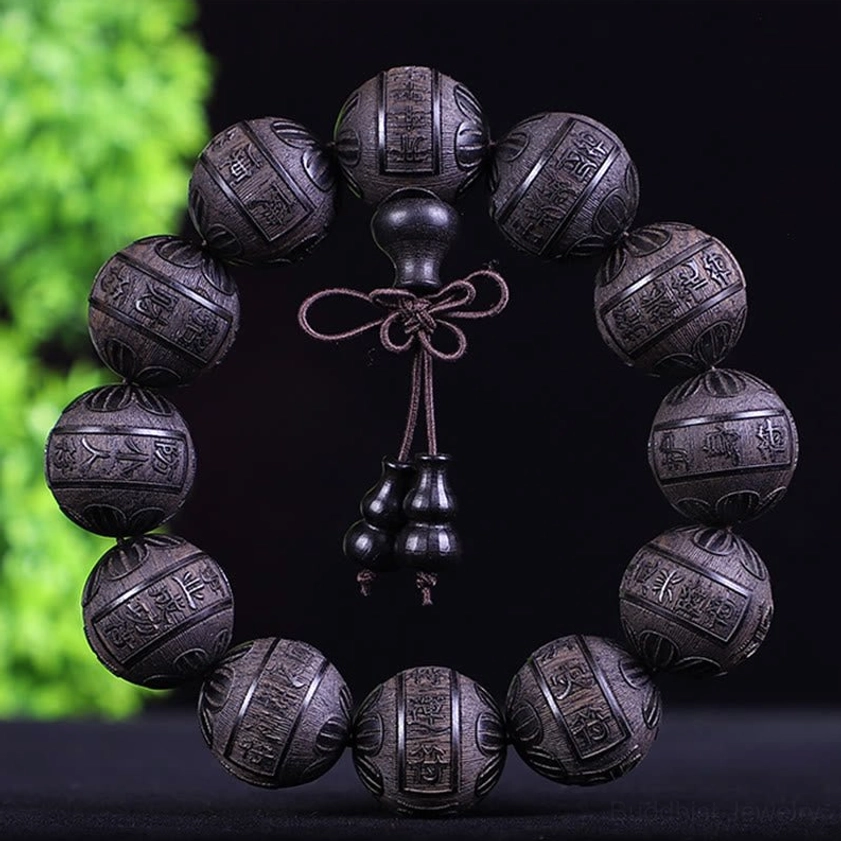 African blackwood twelve blessings bracelet with carved beads representing abundance and good fortune