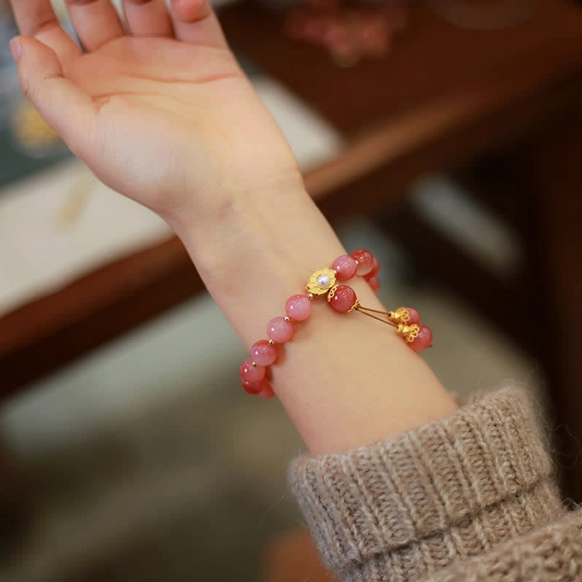Sterling silver agate lotus bracelet on empty palm showing minimal elegant styling