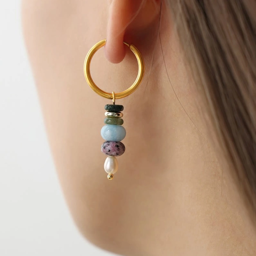 Single dangle hoop earring with layered agate stones - close-up detail of handcrafted Buddhist gemstone jewelry