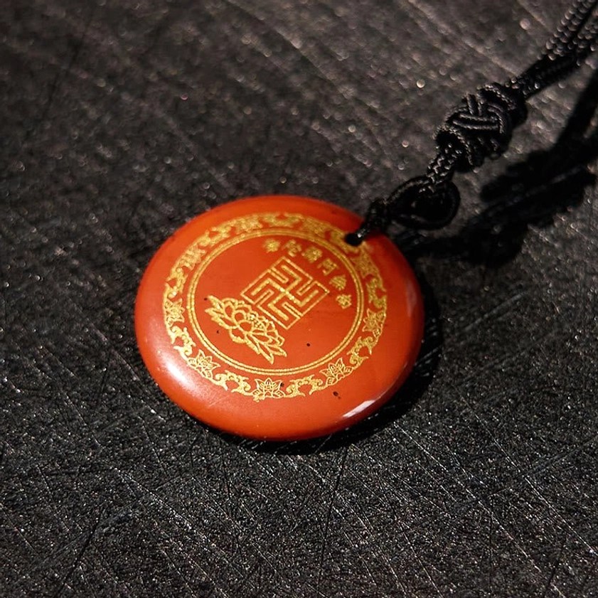 Agate Buddhist pendant natural stone swastika lotus pattern overhead photography