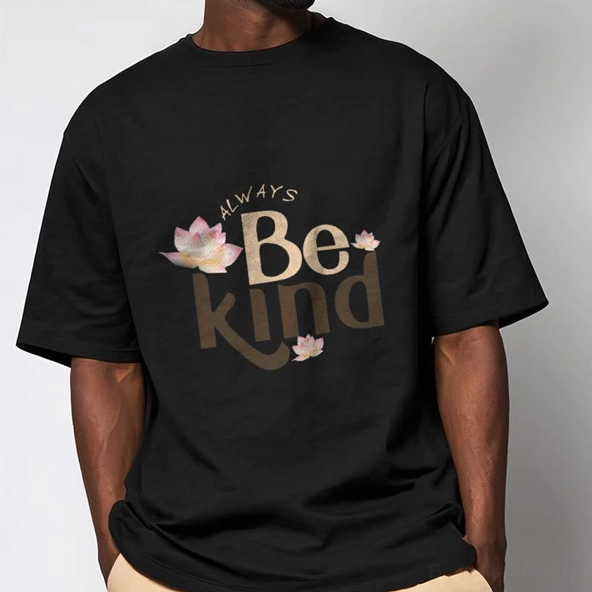 Male model wearing black Always Be Kind Buddhist T-Shirt with lotus print, relaxed crew neck fit