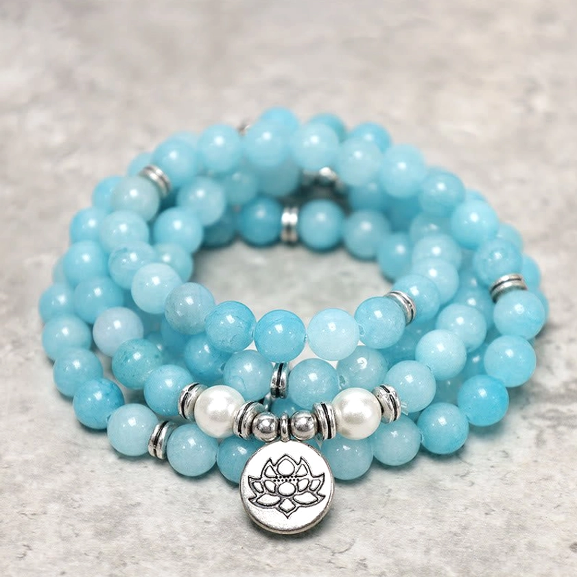 Stacked amazonite mala bracelet coils showing multiple loops with lotus pendant detail