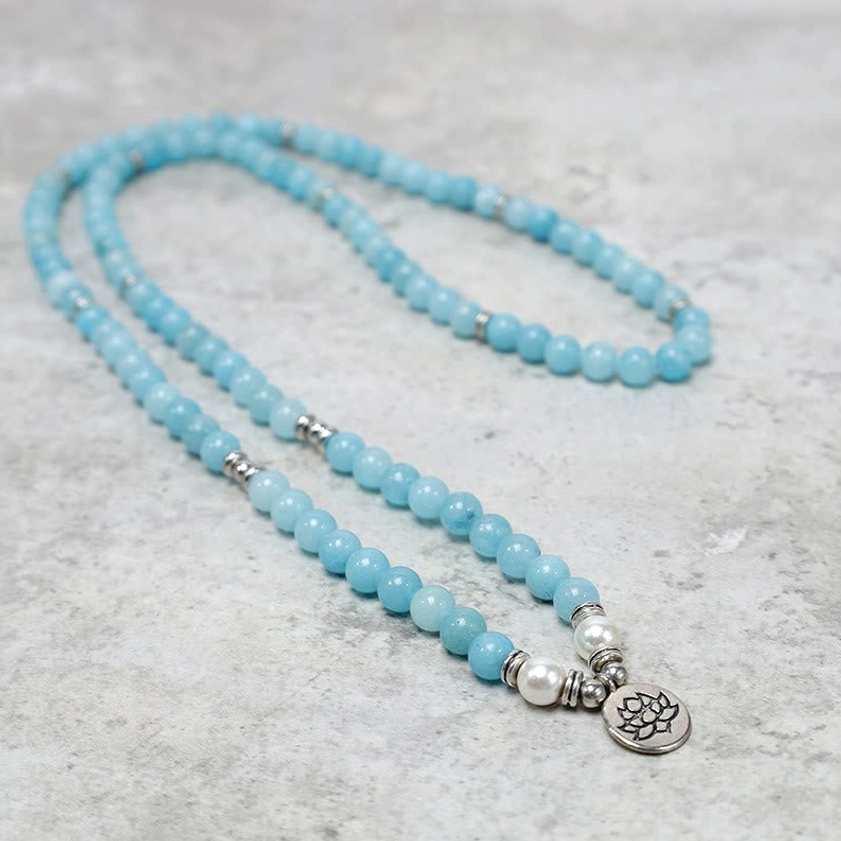 Long coiled amazonite mala necklace with blue beads and silver end charms lotus design