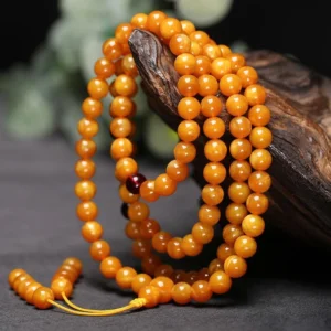 Warm amber round bead mala 108 beads with dark red spacer and yellow tassel, artisan handcrafted Buddhist prayer mala for meditation
