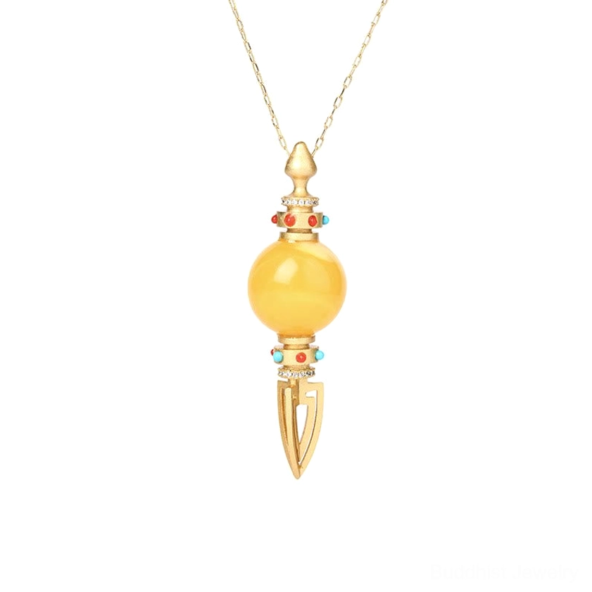 Handmade amber dorje vajra Buddhist necklace on gold chain, full pendant view isolated