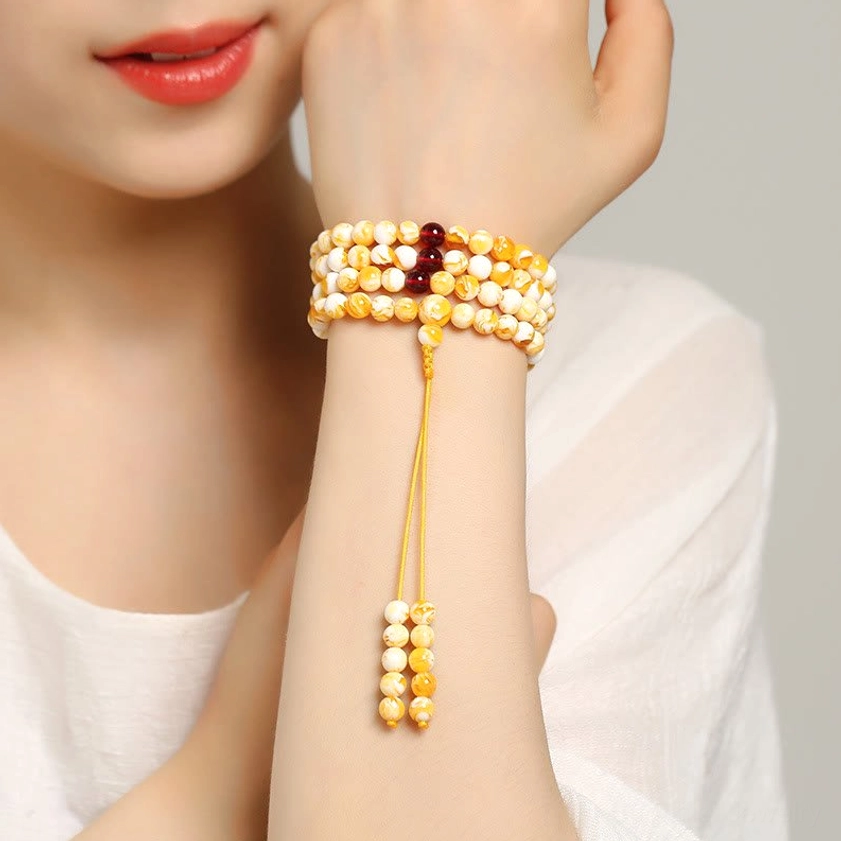 Amber mala beads handcrafted detail hand-polished smooth radiant finish white and golden tones