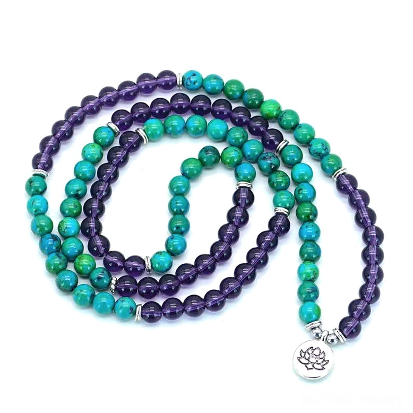Single strand amethyst and green aventurine lotus bracelet loosely coiled on white background