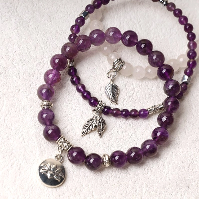 Handcrafted amethyst healing crystal bracelets with natural beads and silver leaf charm - side angle view