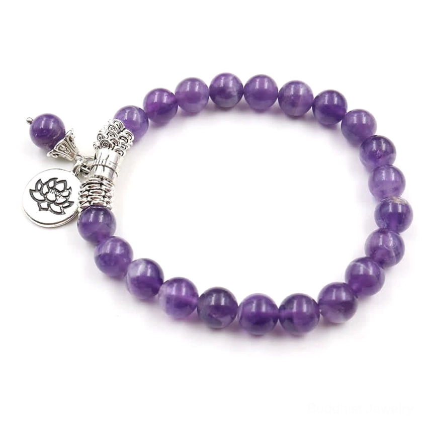 Complete amethyst beaded bracelet flat lay showing full loop of purple gemstone beads with silver charm set on white background