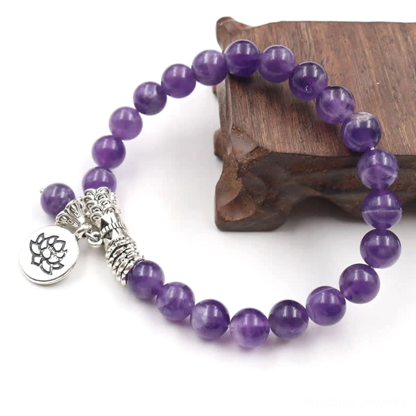 Purple amethyst bracelet three-quarter view featuring dual silver lotus charms with twisted silver decorative details