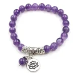Amethyst lotus bracelet flat lay featuring purple amethyst beads with silver lotus charm on white background