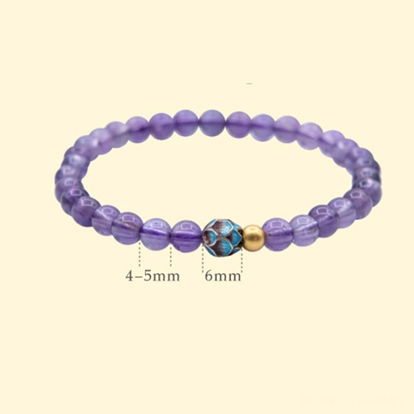 Amethyst crystal beads and lotus charm detail shot showing natural stone quality and artisan handmade craftsmanship