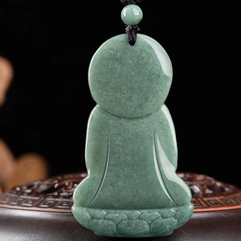 Amitabha Buddha jade amulet back view on carved wooden base, displaying plain smooth jade back with lotus-shaped pedestal