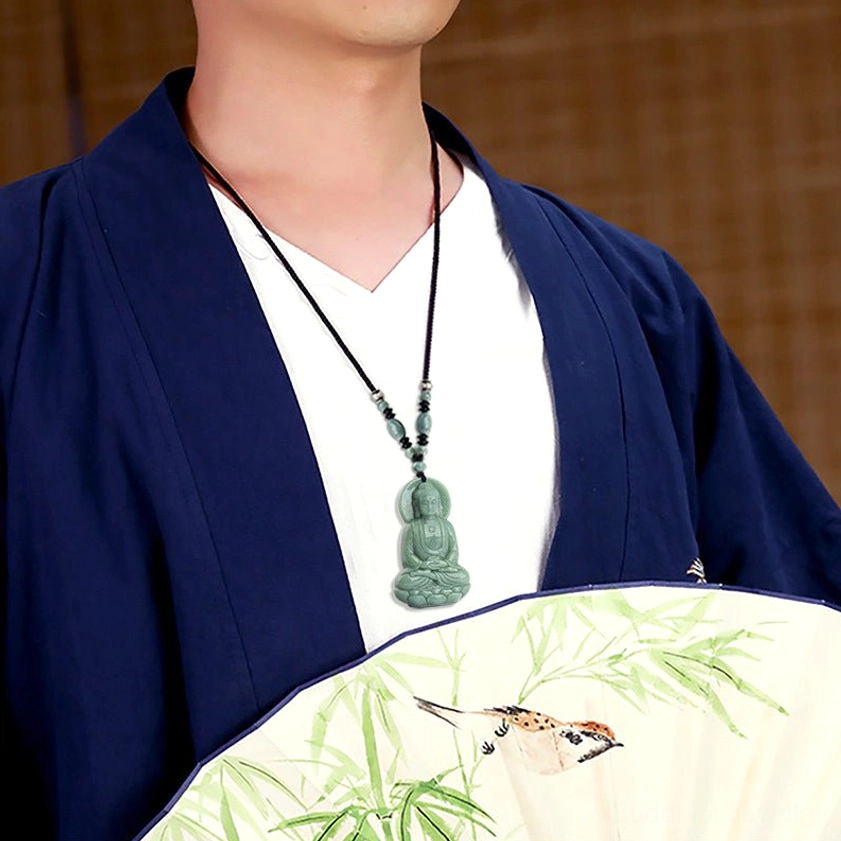 Amitabha Buddha jade pendant necklace worn on male model in traditional outfit, featuring black cord with jade bead accents