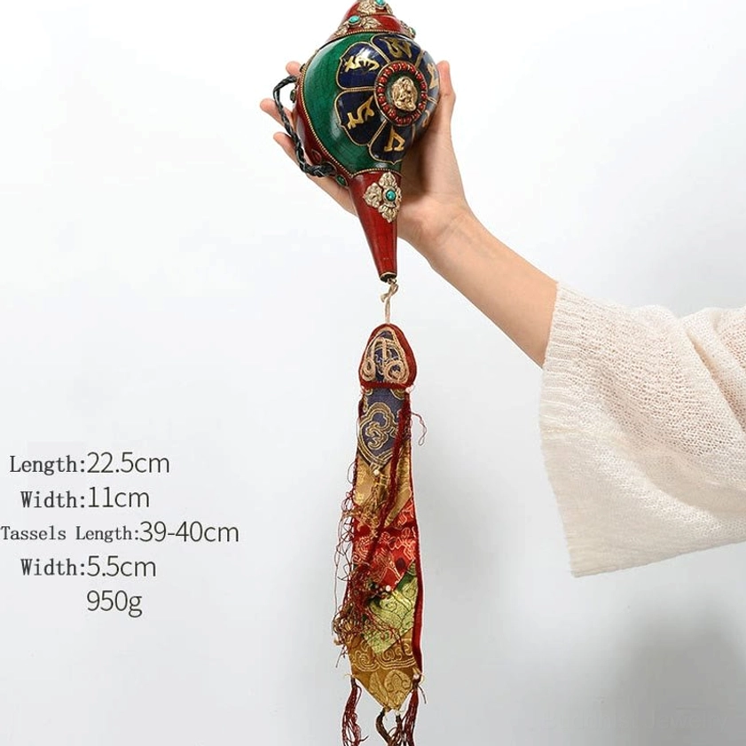 Handcrafted Buddhist conch shell with Amoghasiddhi Buddha symbol, turquoise inlay, and copper medallion details