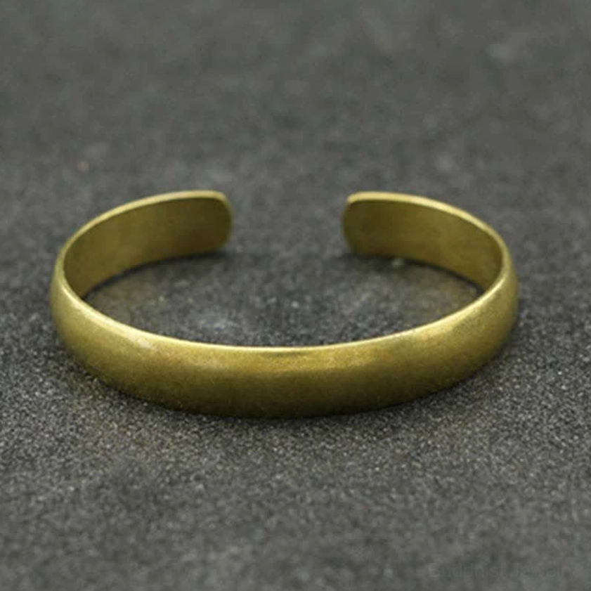 Antique bronze brass open cuff bangle top-down view